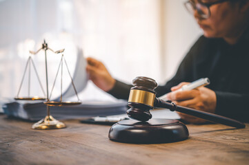 Law theme, mallet of the judge, law enforcement officers, evidence-based cases, and documents taken...