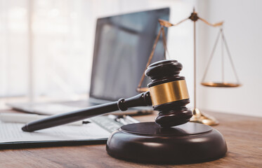 Law theme, mallet of the judge, law enforcement officers, evidence-based cases and documents taken...