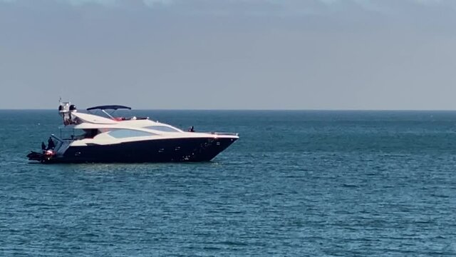 Luxury small yacht, boat in ocean water, Malibu, CA