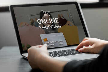 Close up of women shopping online on laptop computer with payment via credit card, E-Commerce and business online concept.