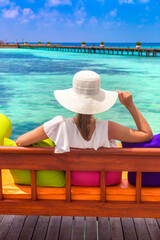 Woman on swing at beach