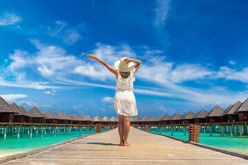 Woman standing on the wooden pier
