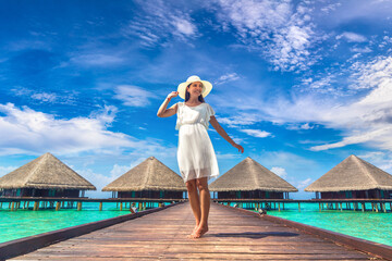 Woman standing on the wooden pier