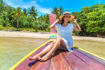 Woman on boat in Thailand - obrazy, fototapety, plakaty