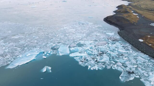 drone over ice and Diamond Beach, Iceland