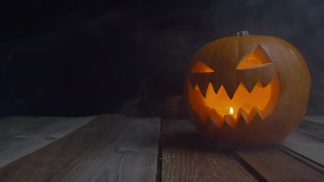 Traditional Jack-o'-lantern Pumpkin Lit From Within By A Tealight. - close up