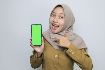Shock government worker women showing blank screen on smartphone. PNS wearing khaki uniform.