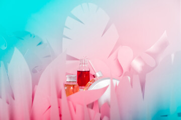 Dropper glass bottles with pipette standing on a white podium. Transparent hyaluronic natural beauty mineral product and eco serum skin care concept.