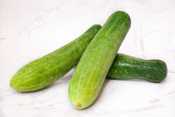 Fresh cucumber with white background