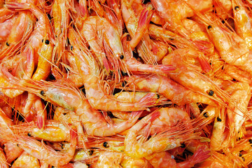 lots of red shrimp. a dish of fresh seafood. a natural source of protein. less meat consumption. selective focus