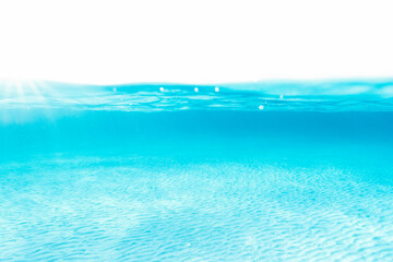Naklejka na ściany i meble (Selective focus) Underwater shot, crystal clear, turquoise water forming a natural background. La Maddalena Archipelago, Sardinia, Italy.
