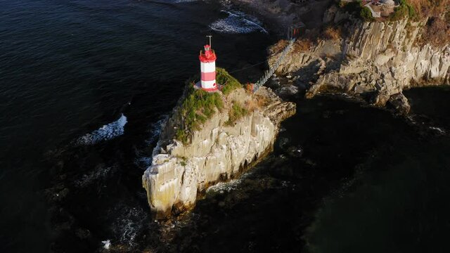 Drone view of the picturesque old Basargin lighthouse on the coast of the sea