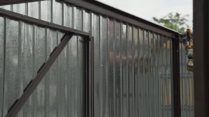 Assembling a prefabricated metal outbuilding with an iron cutter machine