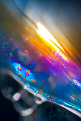 View into a microscopic world of soap bubbles, uncovered light, artistic multicolored surreal detail.