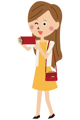 ポップな若い女性　スマホで撮影　旅行