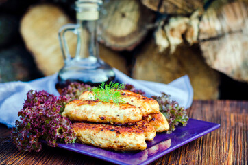Chicken cutlets on a plate with lettuce