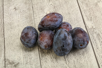 Purple sweet ripe plum heap