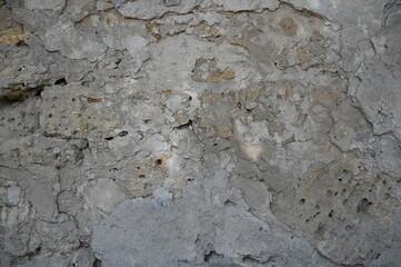 Old dirty wall close up. Grunge abstract photo background.  Beautiful stone texture pattern.
