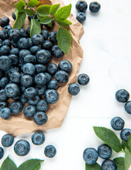 Blueberries on white tile  background