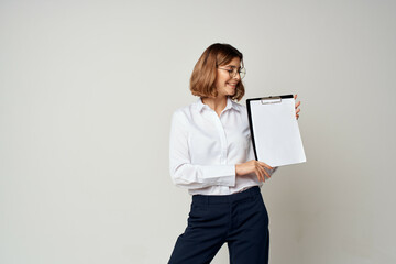 woman manager in white shirt with folder in hands documents office