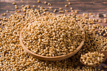 wheat grain on wooden background