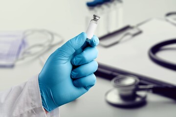 The nurse holding Covid19 vaccine in hand