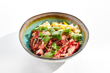 Chinese traditional dish - fried rice with vegetables, shredded omelette and chicken. Pan asian wok with rice and egg on white background. Nasi goreng with chicken on isolated background with shadows.