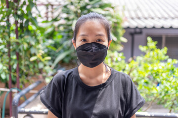 Beautiful caucasian young woman with a disposable face mask. Protection versus viruses and infection,corona viruses