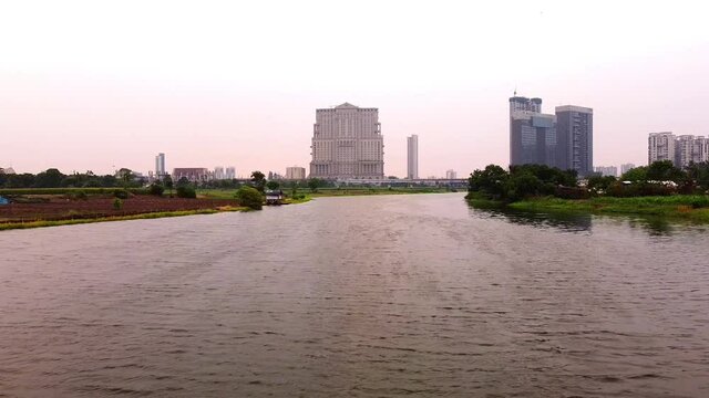 Aerial view of ITC Sonar Royal Bengal from a nearby farm in summer day. City life from drone. Exclusive aerial view of ITC Royal Bengal and JW Marriott from the water body.
