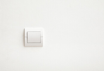 Modern light switch on white wall