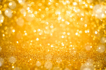 Christmas and New Years holiday golden bokeh background with copy space