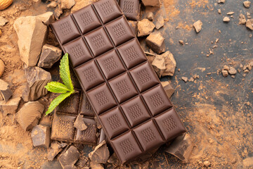 chocolate. dark chocolate bar stack and cocoa powder with mint leaf. Confectionery, confection concept 