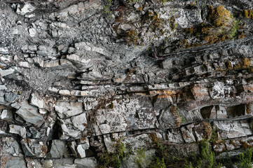 Stone wall in the mountains. Stone wall texture.