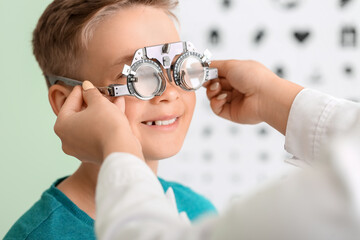 Little boy undergoing eye test in clinic