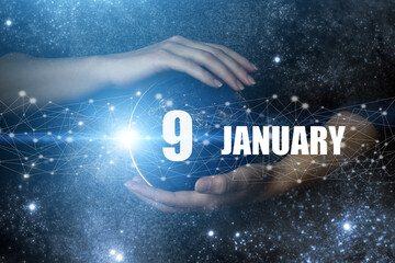 January 9th. Day 9 of month, Calendar date. Human holding in hands earth globe planet with calendar...