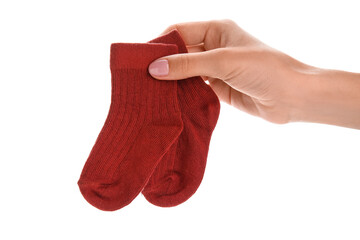 Woman holding baby socks on white background