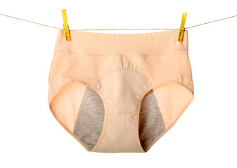 Period panties hanging on rope against white background