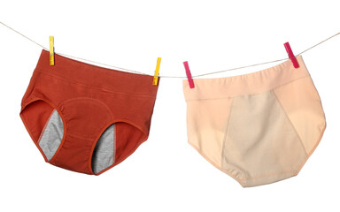 Period panties hanging on rope against white background