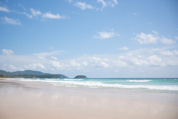 Beach with blue sky.clean sea white clouds soft daylight.