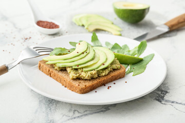 Avocado toast with guacamole on table, closeup