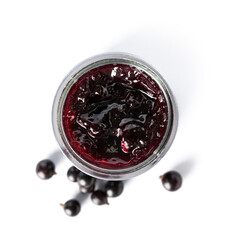Jar with black currant jam on white background