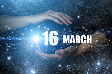 March 16th. Day 16 of month, Calendar date. Human holding in hands earth globe planet with calendar...