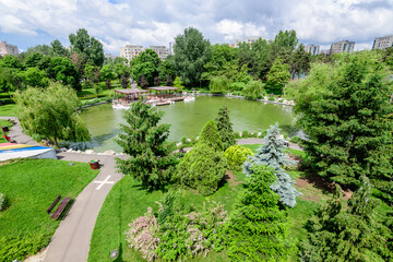 Landscape with lake and vivid green trees in Drumul Taberei Park (Parcul Drumul Taberei) also known...