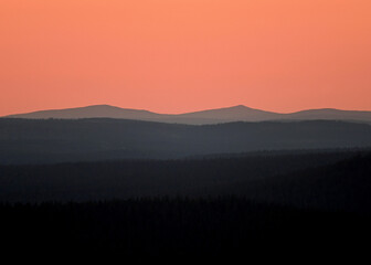 Evening blush above distant fells at sunset in Pallas-Ylläs National Park in Lapland, Finland.