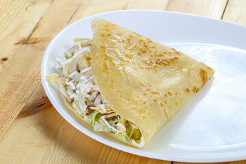 Pancake with chicken caesar salad