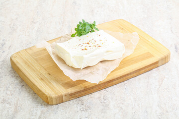 Greek Feta cheese over board