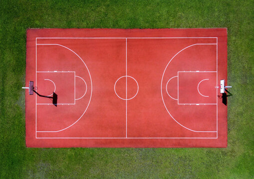 Red basketball court with marking lines