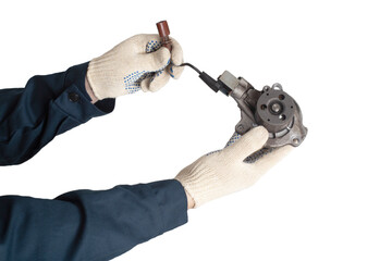 An auto mechanic holds a faulty car cooling system pump that drives coolant, white background,...