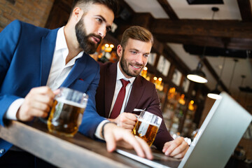 Handsome two businessmen have a meeting in a restaurant