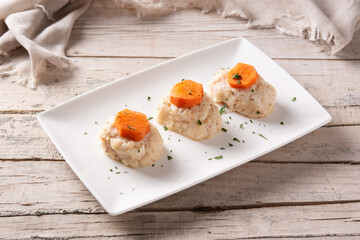 Traditional Jewish gefilte fish on wooden table. 
